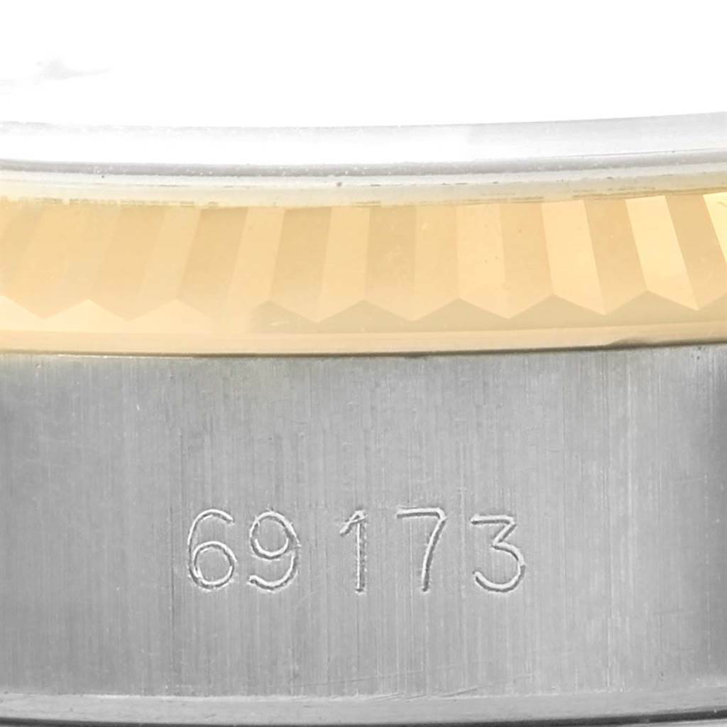 This close-up image shows the bezel and part of the case with the model number (69173) engraved on a Rolex Date 69173 Women's Stainless Steel Blue Dial 69173 Women's Stainless Steel Blue Dial watch.