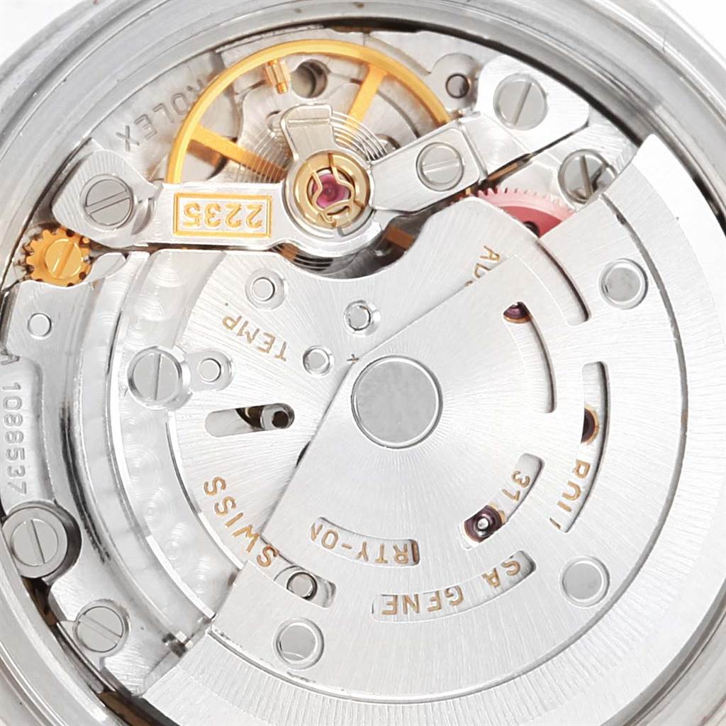 The image shows the rear view of a Rolex Date 79174 Women's Stainless Steel Blue Dial 79174 Women's Stainless Steel Blue Dial model watch, focusing on its intricate internal mechanical movement.