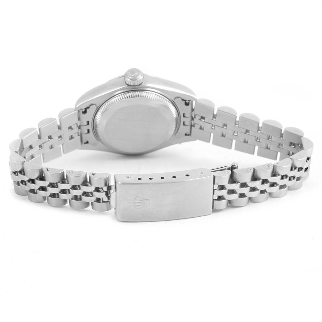 This photo shows the back case, winding crown, and bracelet clasp of a Rolex Date 79174 Women's Stainless Steel Blue Dial 79174 Women's Stainless Steel Blue Dial model watch.