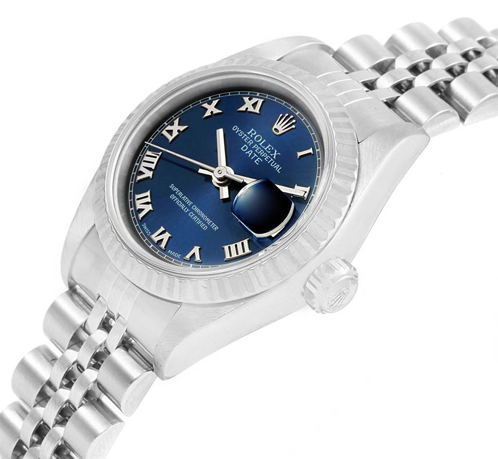 This image shows a close-up, side view of a Rolex Oyster Perpetual Date watch, highlighting the blue dial, fluted bezel, and Jubilee bracelet.