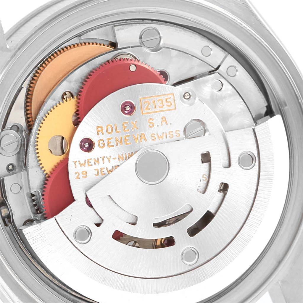 This image shows the internal mechanism and movement of the Rolex Date 69190 Women's Stainless Steel Blue Dial 69190 Women's Stainless Steel Blue Dial model watch, highlighting the gears and rotor.