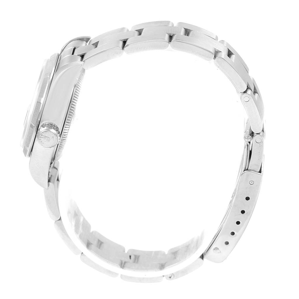 This image shows a side view of a Rolex Date 69190 Women's Stainless Steel Blue Dial 69190 Women's Stainless Steel Blue Dial model watch, highlighting the crown, case, and bracelet links.