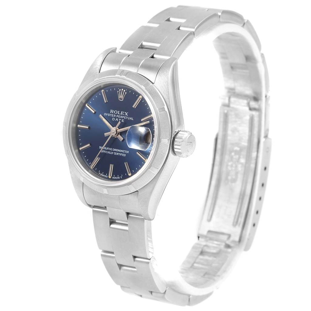 The Rolex Date 69190 Women's Stainless Steel Blue Dial 69190 Women's Stainless Steel Blue Dial watch is shown at a three-quarter angle, displaying its face, bezel, crown, and bracelet.