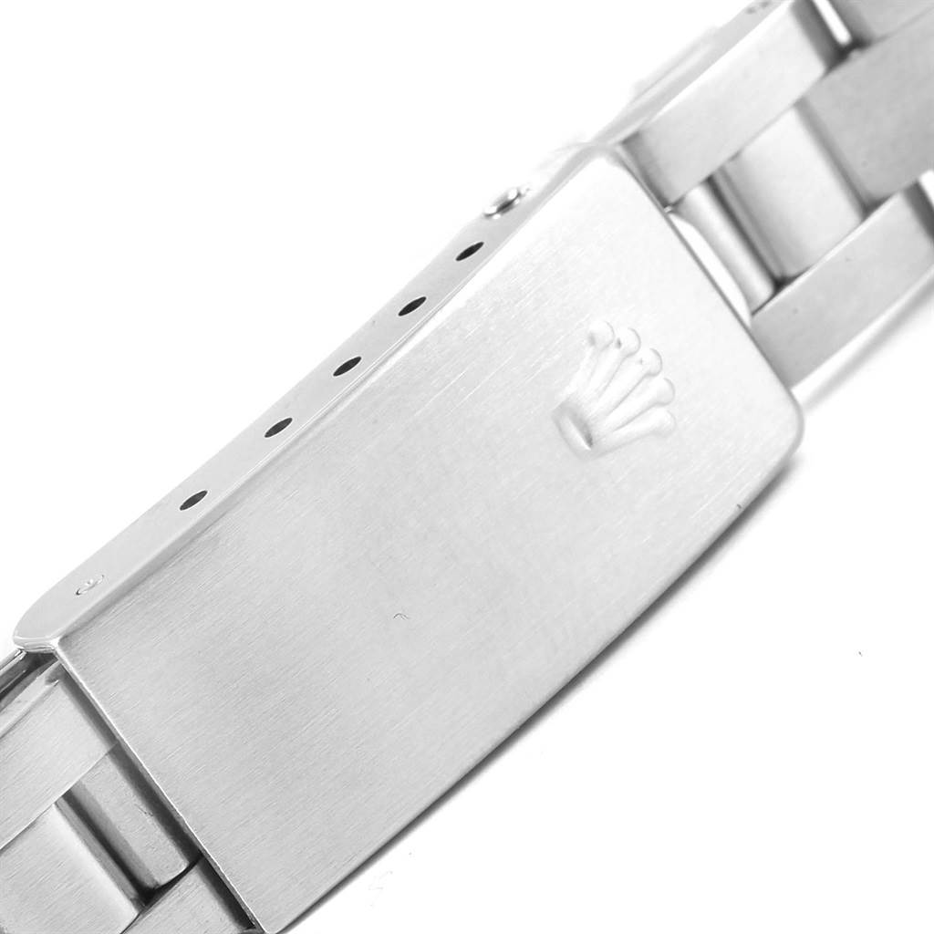 This image shows a close-up of the clasp and part of the bracelet of a Rolex Date 69190 Women's Stainless Steel Blue Dial 69190 Women's Stainless Steel Blue Dial model watch.