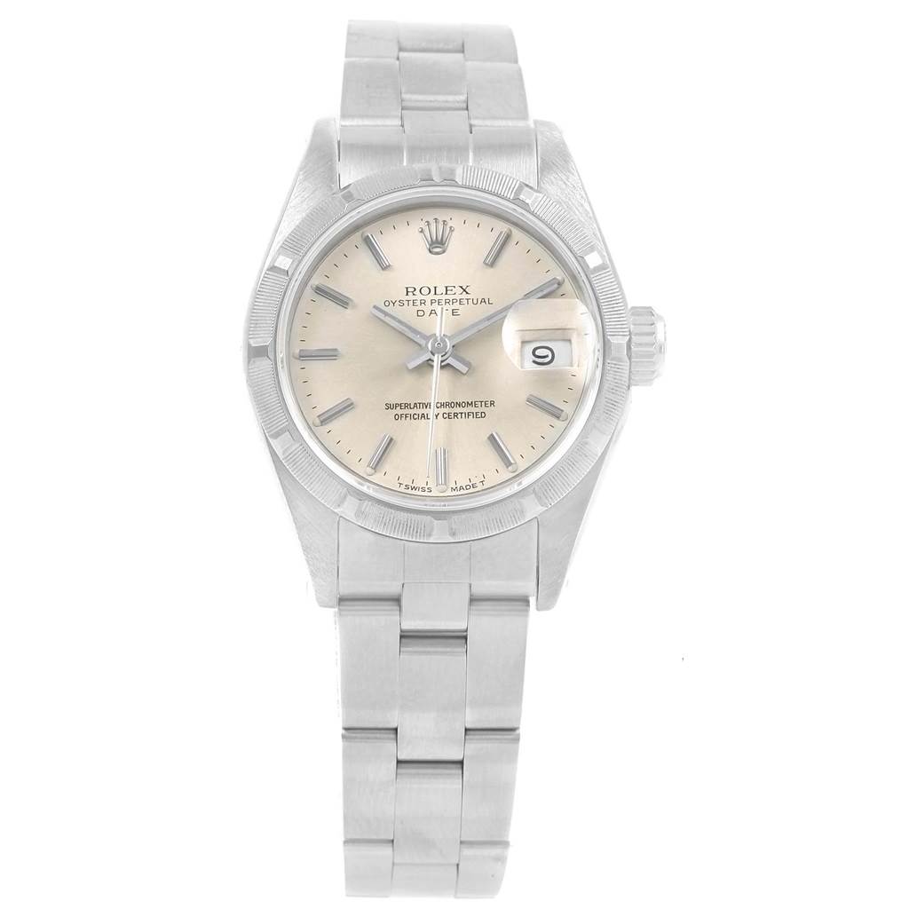 The image shows a front view of a Rolex Oyster Perpetual Date model, displaying the dial, hands, bracelet, and crown.