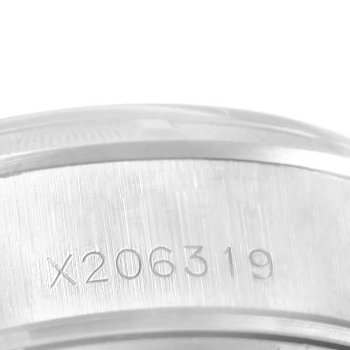 The image shows a close-up of the engraved serial number on the case side of a Rolex Date 69190 Women's Stainless Steel Silver Dial 69190 Women's Stainless Steel Silver Dial watch.