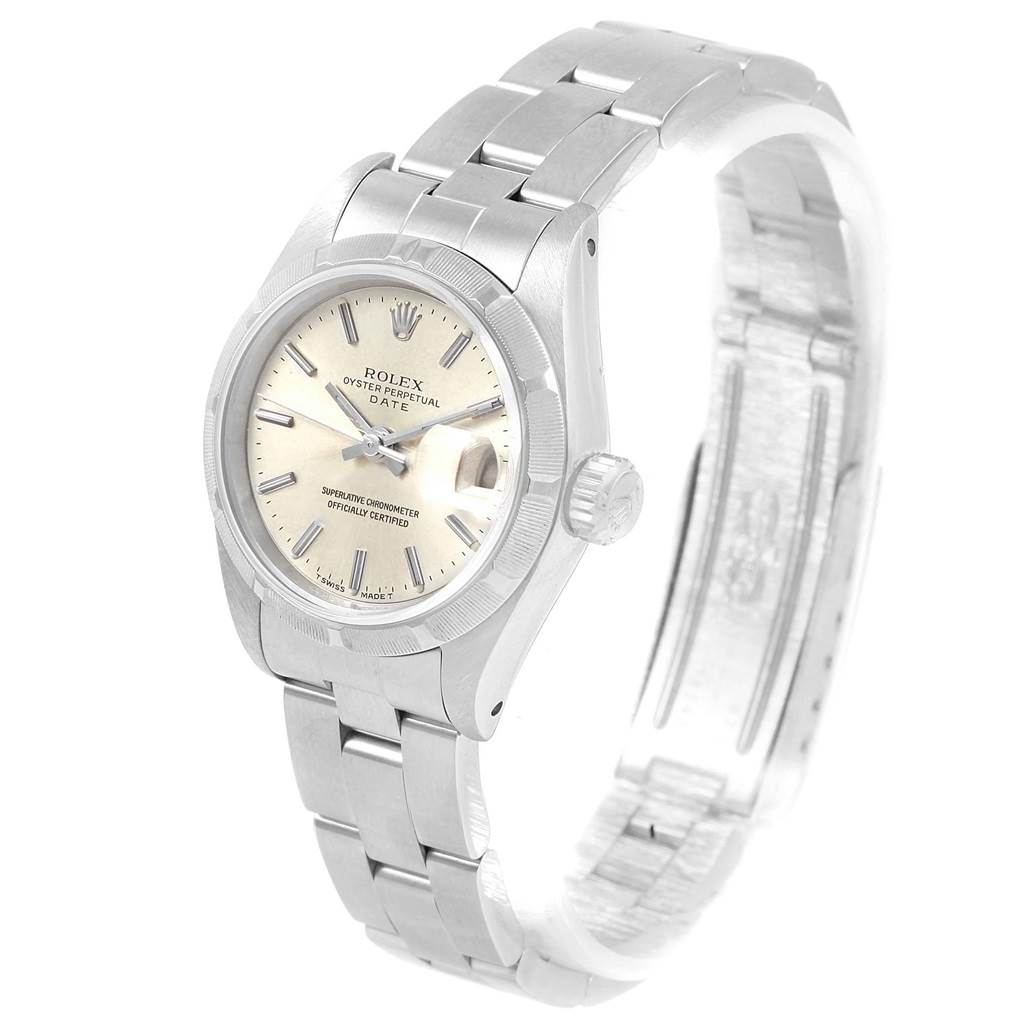 This image shows a Rolex Date 69190 Women's Stainless Steel Silver Dial 69190 Women's Stainless Steel Silver Dial model watch at a three-quarter angle, focusing on its face, bezel, and bracelet.