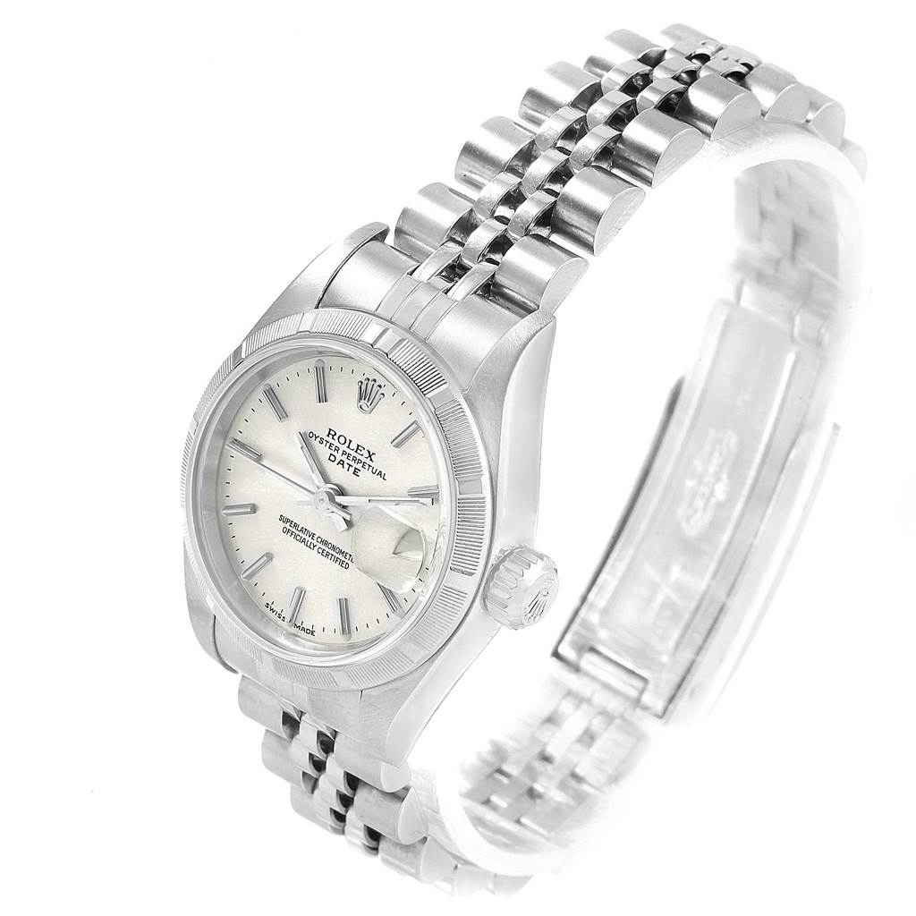 The image shows a Rolex Date 79190 Women's Stainless Steel Silver Dial 79190 Women's Stainless Steel Silver Dial model watch angled showing its face, bezel, crown, and partially open bracelet.