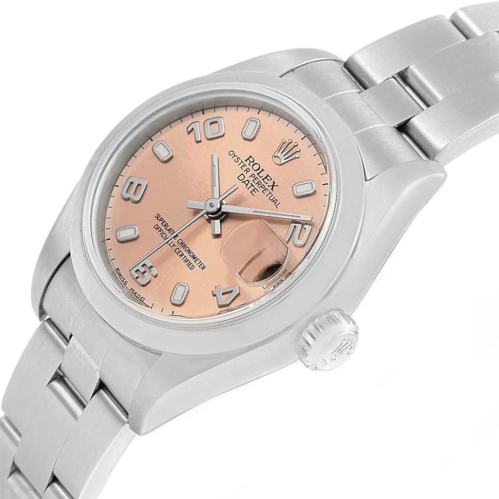 The Rolex Date 79160 Women's Stainless Steel Pink Dial 79160 Women's Stainless Steel Pink Dial watch is shown at a three-quarter angle, featuring its dial, bezel, crown, bracelet, and date magnifier.