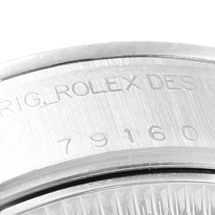 This is a close-up angle of the serial number engraving on the side of the Rolex Date 79160 Women's Stainless Steel Pink Dial 79160 Women's Stainless Steel Pink Dial watch.