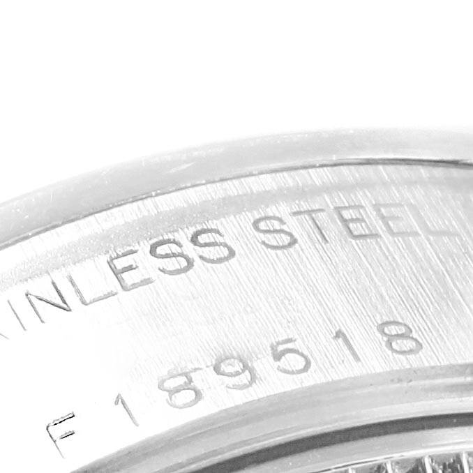 The image shows an angled close-up of the case back and serial number of a Rolex Date 79160 Women's Stainless Steel Pink Dial 79160 Women's Stainless Steel Pink Dial model watch.