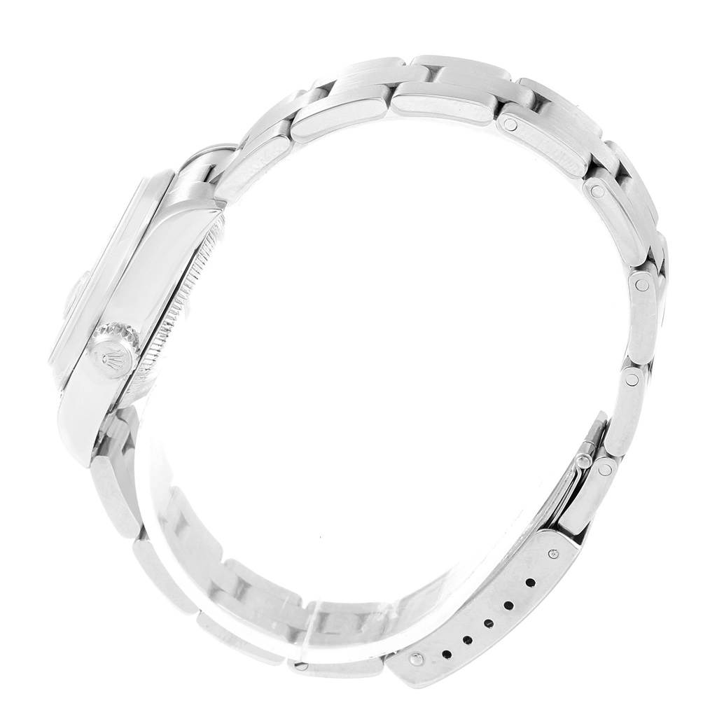 The image shows a side view of the Rolex Date 79160 Women's Stainless Steel Pink Dial 79160 Women's Stainless Steel Pink Dial model watch, highlighting the case, crown, and bracelet.