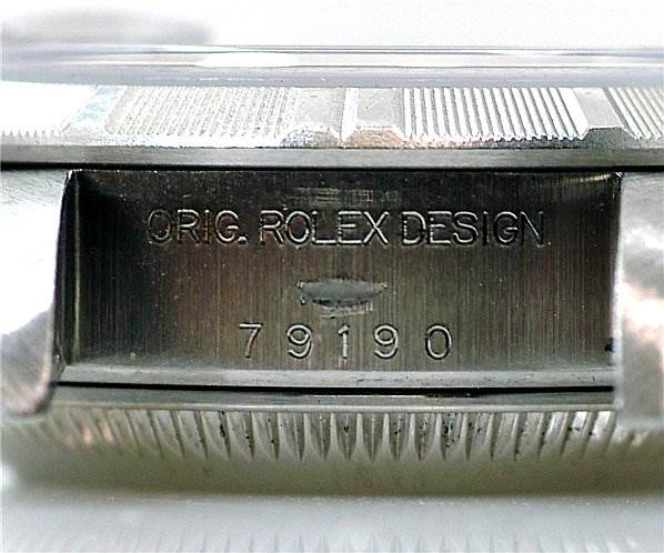 This image shows the engraved casing and model number of a Rolex Date 79190 Women's Stainless Steel Black Dial 79190 Women's Stainless Steel Black Dial watch, viewed from the side.