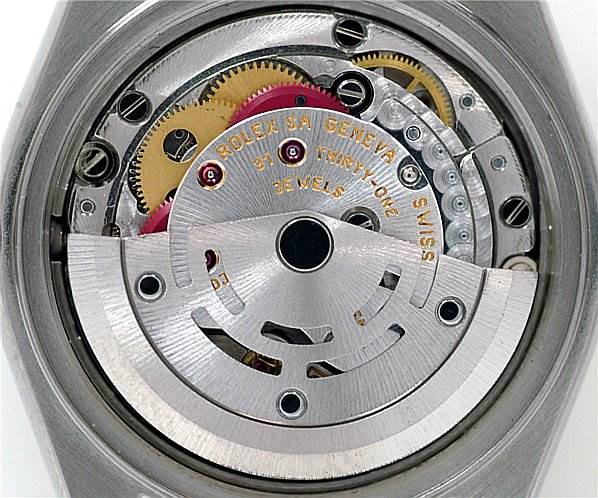 This image shows the internal movement and components of a Rolex Date 79190 Women's Stainless Steel Black Dial 79190 Women's Stainless Steel Black Dial model watch from a back angle.