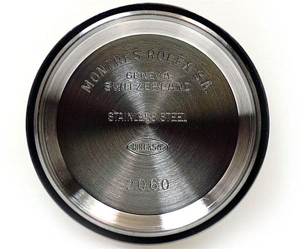 This image shows the internal case back of a Rolex Date 79190 Women's Stainless Steel Black Dial 79190 Women's Stainless Steel Black Dial model watch, displaying engravings and the stainless steel material.