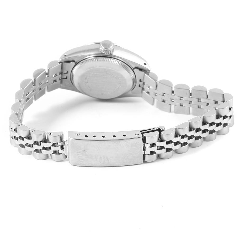 The image shows the back of the Rolex Date 79160 Women's Stainless Steel Pink Dial 79160 Women's Stainless Steel Pink Dial model watch with a focus on the case back and metal bracelet.