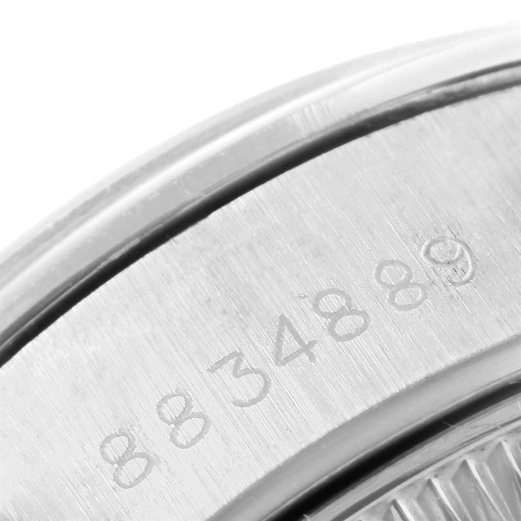 This image shows a close-up view of the serial number engraving on the back case of a Rolex Date 79160 Women's Stainless Steel Pink Dial 79160 Women's Stainless Steel Pink Dial watch.