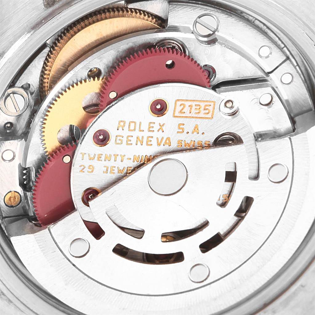 This is a close-up view of the inner mechanism of a Rolex Date 79160 Women's Stainless Steel Pink Dial 79160 Women's Stainless Steel Pink Dial model, highlighting gears and the movement parts.