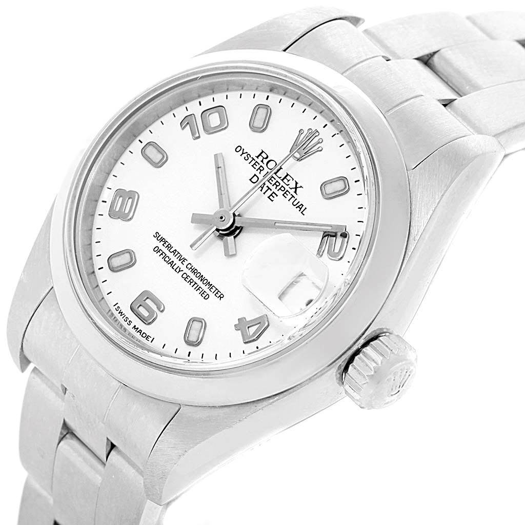 The image shows an angled view of the Rolex Date 79160 Women's Stainless Steel White Dial 79160 Women's Stainless Steel White Dial watch, highlighting its face, bracelet, bezel, and crown.