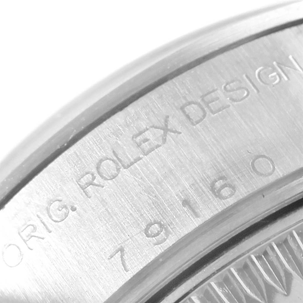The image shows a close-up of the side engraving on a Rolex Date 79160 Women's Stainless Steel White Dial 79160 Women's Stainless Steel White Dial model watch.