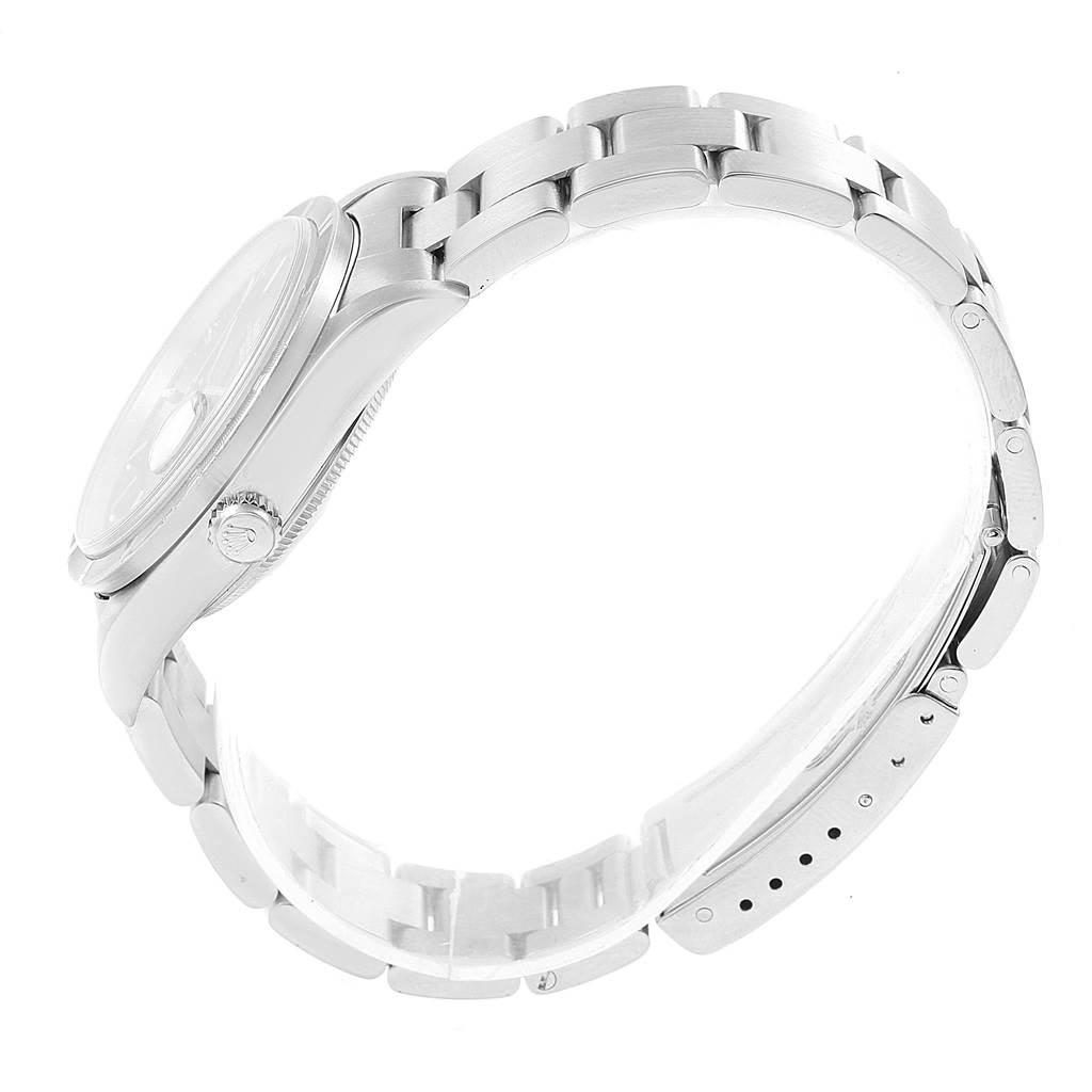 The image shows a side view of a Rolex Date 15210 Men's Stainless Steel Blue Dial 15210 Men's Stainless Steel Blue Dial model, highlighting the bracelet and crown.