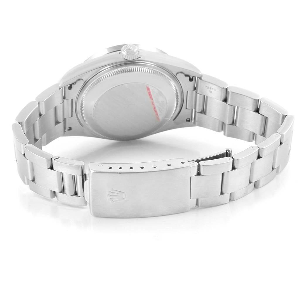 The image shows the back view of a Rolex Date 15210 Men's Stainless Steel Blue Dial 15210 Men's Stainless Steel Blue Dial model watch, highlighting the case back and the clasp.