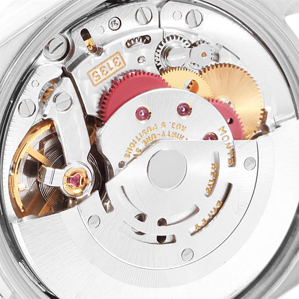 This image shows a close-up view of the movement and inner workings of a Rolex Date 15210 Men's Stainless Steel Blue Dial 15210 Men's Stainless Steel Blue Dial model watch.