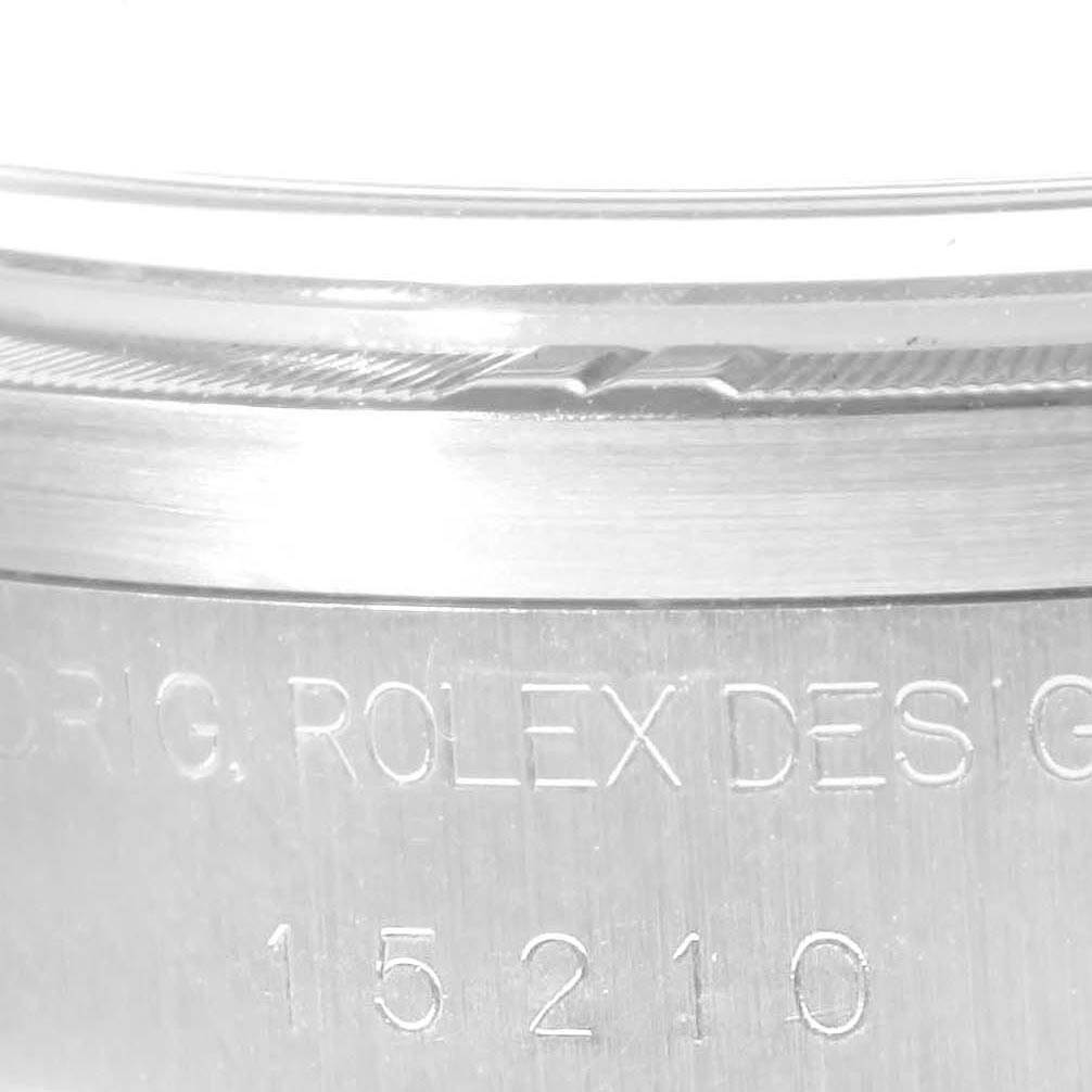 Close-up view of the side of the case on a Rolex Date 15210 Men's Stainless Steel Blue Dial 15210 Men's Stainless Steel Blue Dial watch, showing the engraved model number "15210" and "ROLEX DESIG".