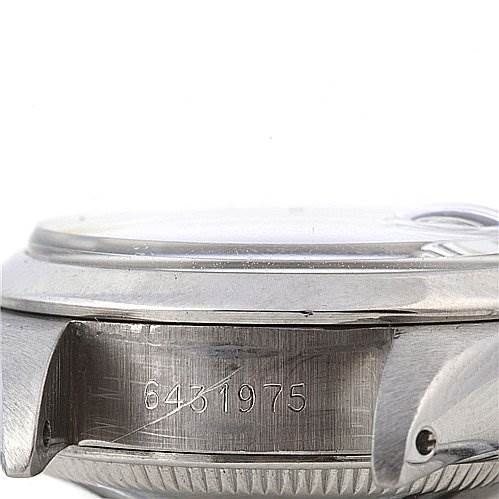 The image shows a close-up, side angle of the Rolex Date 6917 Women's Stainless Steel Mother of Pearl Dial 6917 Women's Stainless Steel Mother of Pearl Dial model, focusing on the watch case and serial number.