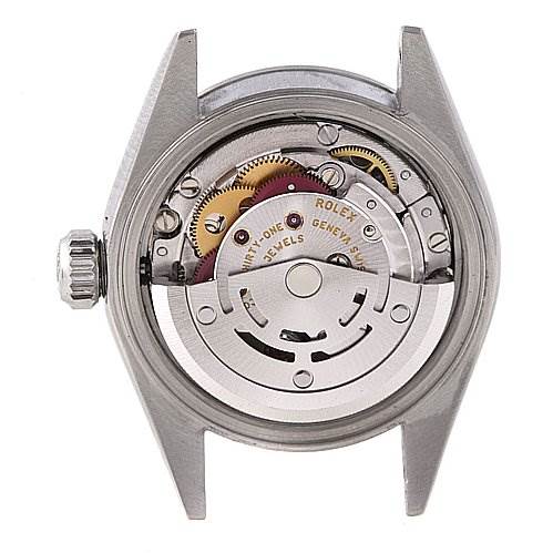The image shows the inner movement of a Rolex Date 79240 Women
s Stainless Steel Silver Dial 79240 Women
s Stainless Steel Silver Dial model watch viewed from the back, highlighting the mechanical parts.