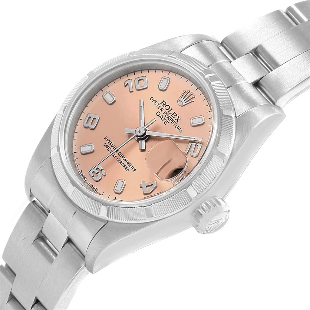 The image shows a Rolex Date 69190 Women's Stainless Steel Pink Dial 69190 Women's Stainless Steel Pink Dial model watch angled slightly downward, displaying its face, bezel, crown, and part of the bracelet.