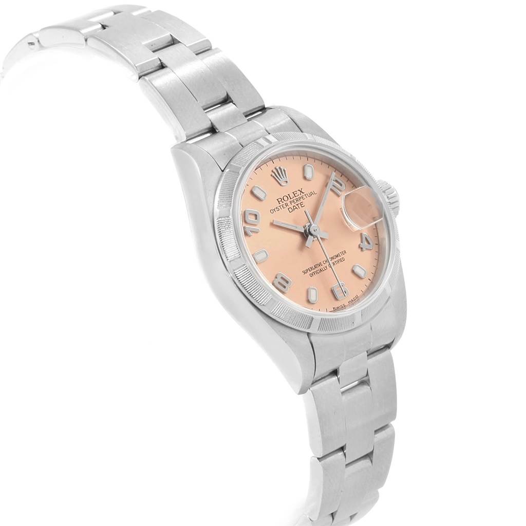 The image shows a side-angled view of a Rolex Date 69190 Women's Stainless Steel Pink Dial 69190 Women's Stainless Steel Pink Dial model watch, highlighting its dial, bezel, and a portion of its bracelet.