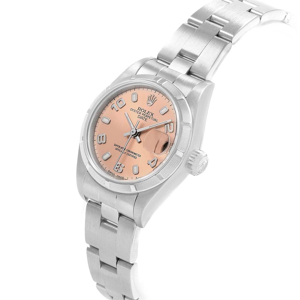 The Rolex Date 69190 Women's Stainless Steel Pink Dial 69190 Women's Stainless Steel Pink Dial watch is shown at an angle, highlighting its pink dial, bezel, crown, and bracelet.