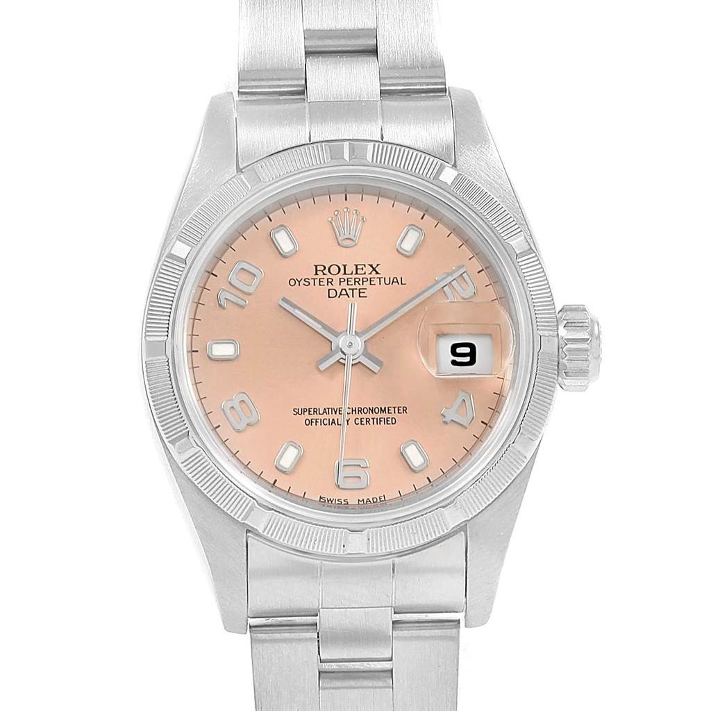 This is a close-up view of a Rolex Date 69190 Women's Stainless Steel Pink Dial 69190 Women's Stainless Steel Pink Dial model watch, showing the face, crown, bracelet, and a portion of the bezel.