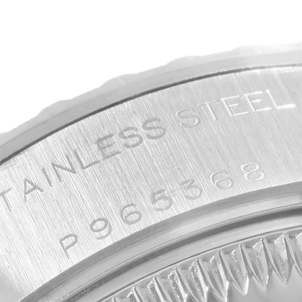 This image shows a close-up of the stainless steel casing and serial number of a Rolex Date 79240 Women's Stainless Steel Silver Dial 79240 Women's Stainless Steel Silver Dial model watch.