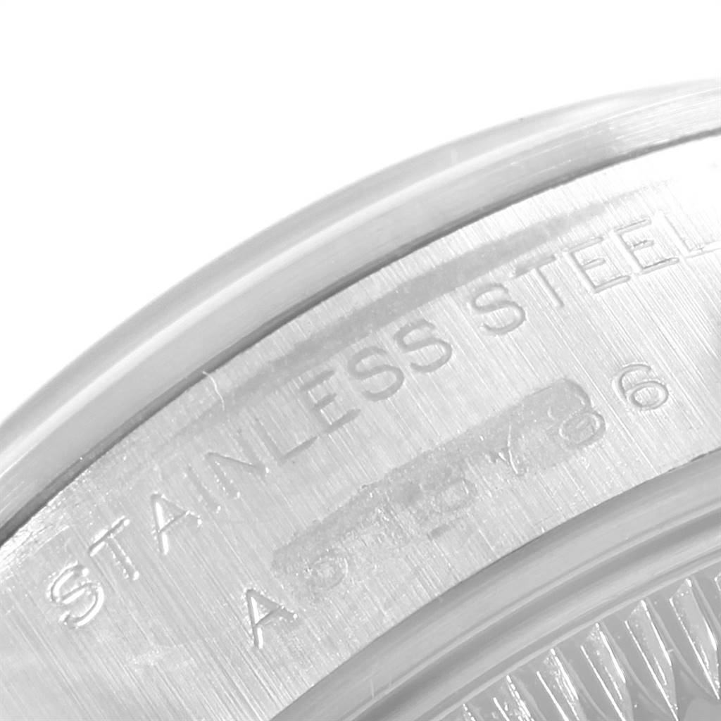 The image shows a close-up of the stainless steel case back of a Rolex Date 79160 Women's Stainless Steel Blue Dial 79160 Women's Stainless Steel Blue Dial model watch.