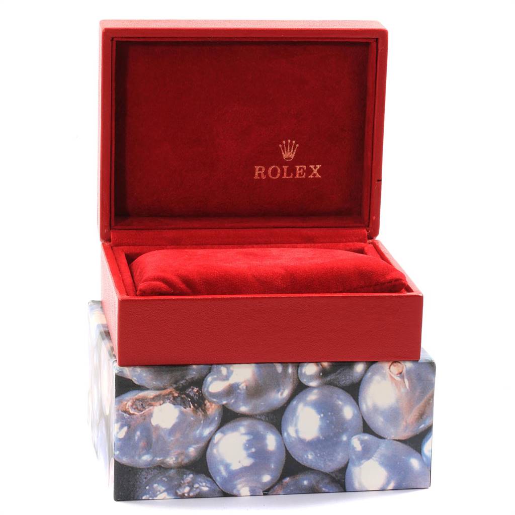 The image shows an open red Rolex Date 79160 Women's Stainless Steel Blue Dial 79160 Women's Stainless Steel Blue Dial model watch box with a velvet cushion inside and the Rolex logo on the interior lid.