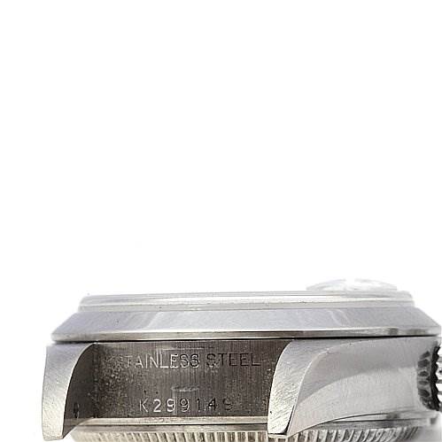 This image shows a side angle of the stainless steel casing and the engraving on a Rolex Date 79160 Women's Stainless Steel White Dial 79160 Women's Stainless Steel White Dial model watch.