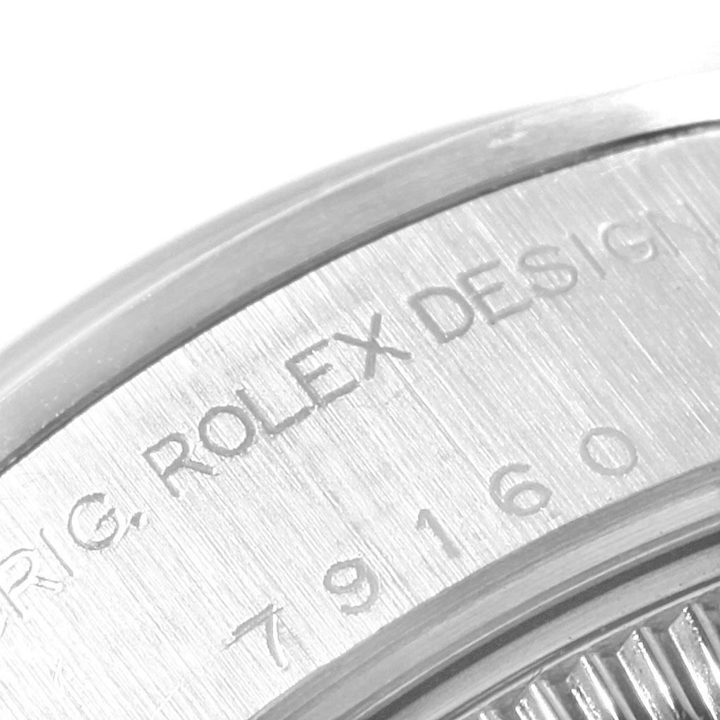 This close-up image shows the case back of a Rolex Date 79160 Women
s Stainless Steel Blue Dial 79160 Women
s Stainless Steel Blue Dial model, focusing on engraved text and serial numbers.