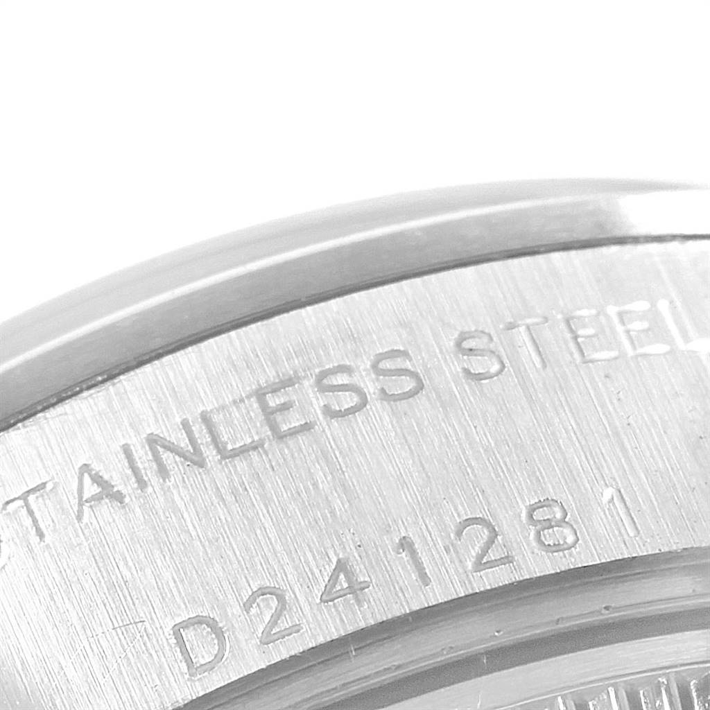 This is a close-up shot of the serial and material engraving on the side of a Rolex Date 79160 Women
s Stainless Steel Blue Dial 79160 Women
s Stainless Steel Blue Dial model watch case.