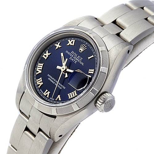 The image shows a Rolex Date 69190 Women's Stainless Steel Blue Dial 69190 Women's Stainless Steel Blue Dial model watch from an angled side view, highlighting the face, bezel, crown, and part of the bracelet.