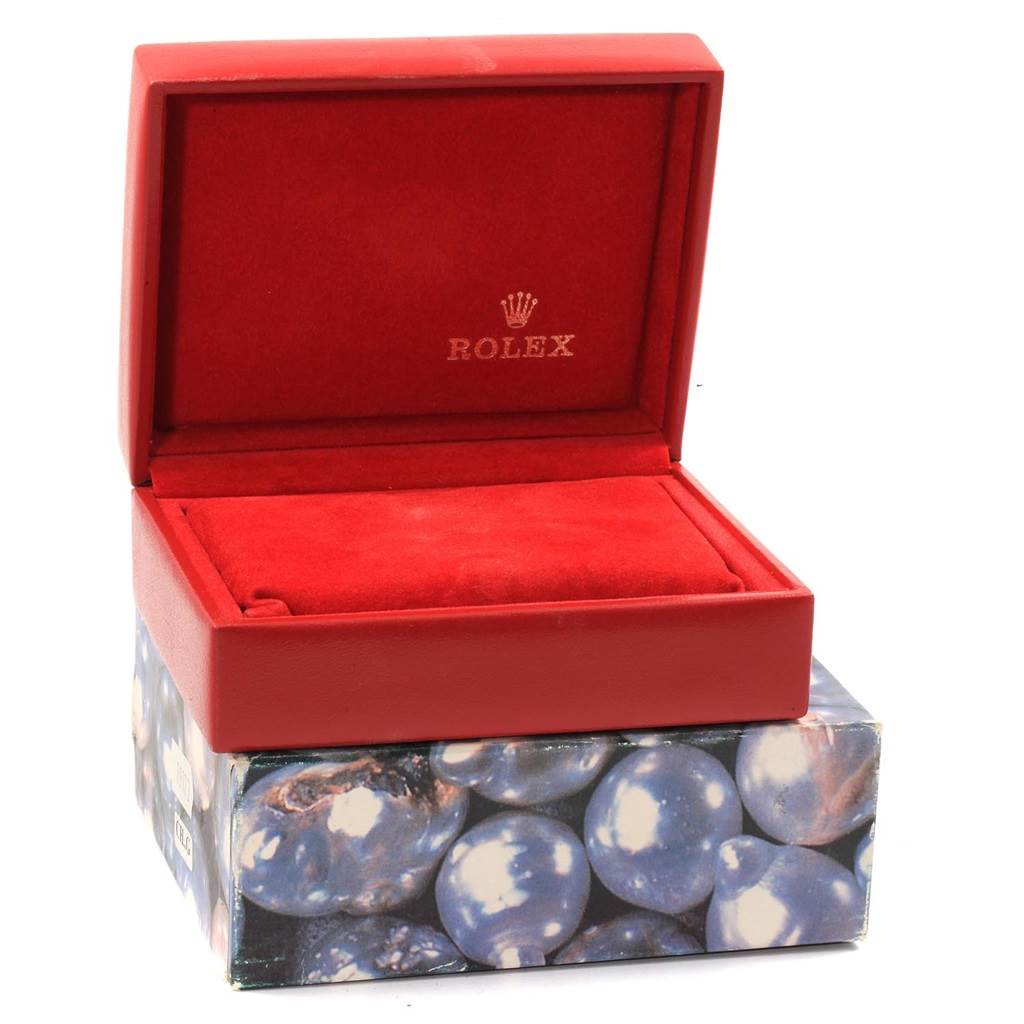 The image shows a red Rolex Date 69160 Women's Stainless Steel Blue Dial 69160 Women's Stainless Steel Blue Dial model watch box with its lid open, displaying a plush interior.