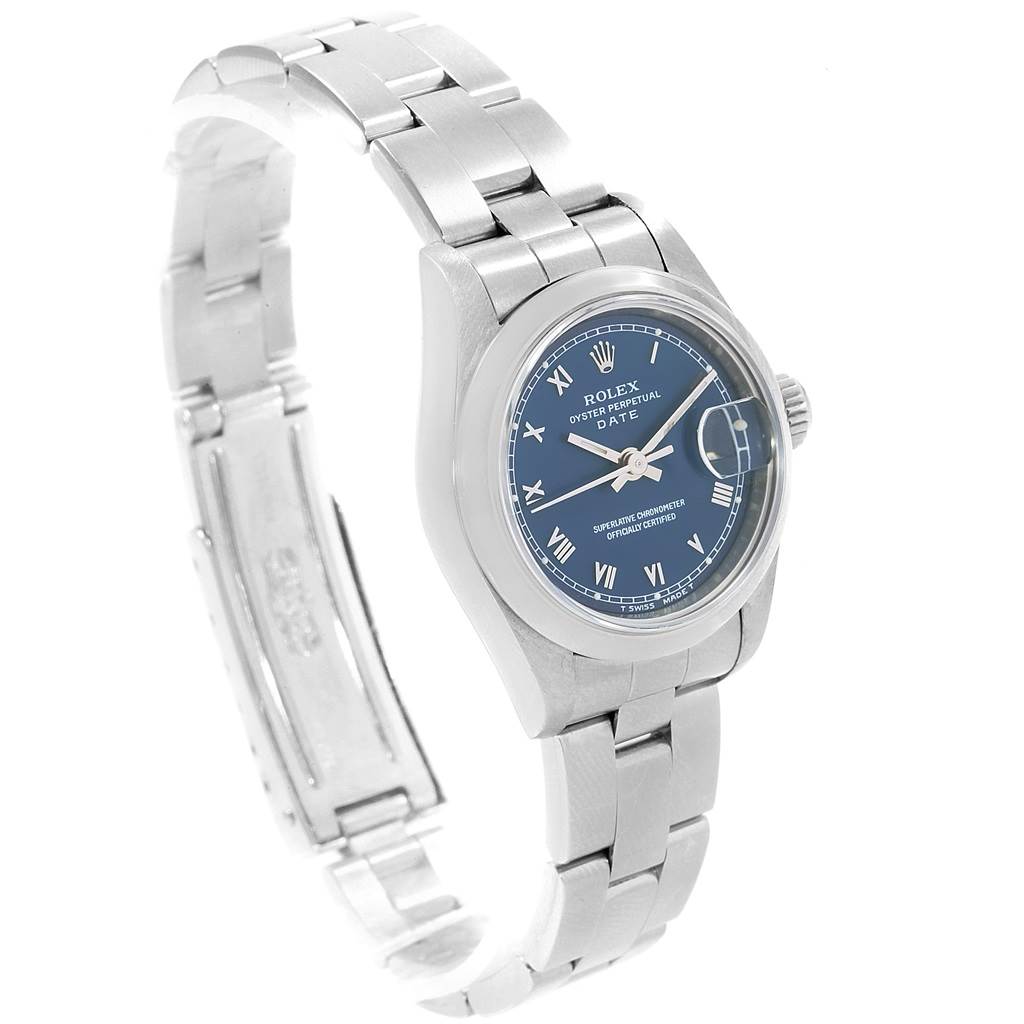 The image shows a Rolex Date 69160 Women's Stainless Steel Blue Dial 69160 Women's Stainless Steel Blue Dial model watch at an angle displaying its dial, bracelet, and partially open clasp.