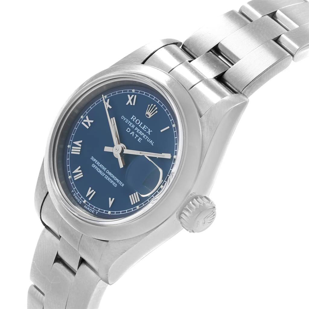 The image shows a close-up of a Rolex Date 69160 Women's Stainless Steel Blue Dial 69160 Women's Stainless Steel Blue Dial model watch with its face, bezel, crown, and part of the bracelet visible.