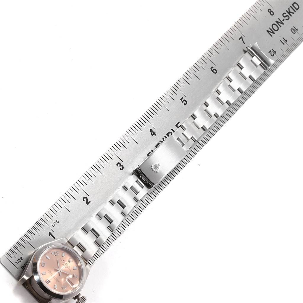 The image shows the watch face and bracelet of a Rolex Date 79160 Women's Stainless Steel Pink Dial 79160 Women's Stainless Steel Pink Dial model laid out against a ruler for measurement.