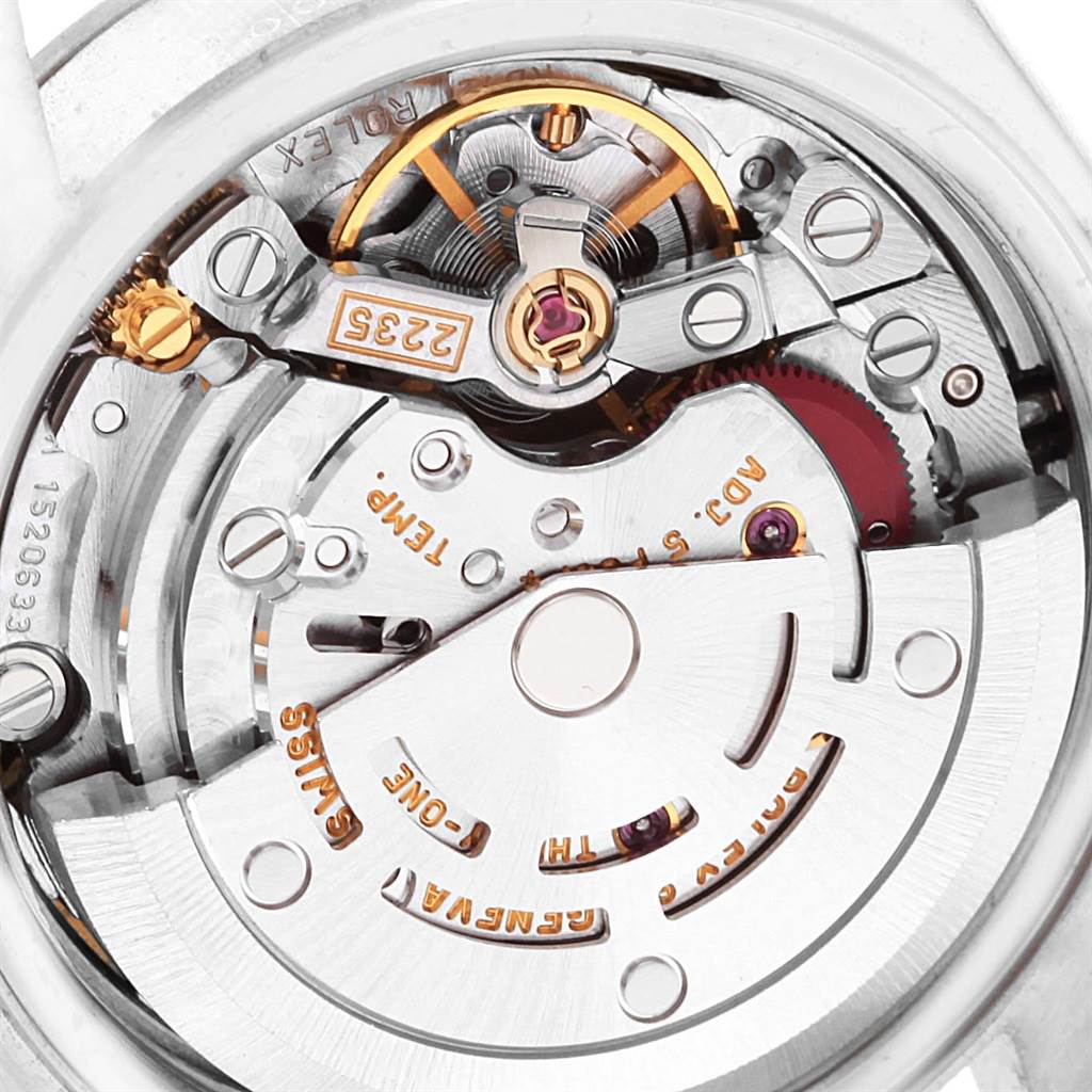 The image shows the inner mechanical movement of a Rolex Date 79160 Women's Stainless Steel Blue Dial 79160 Women's Stainless Steel Blue Dial model watch, displaying gears and intricate components.