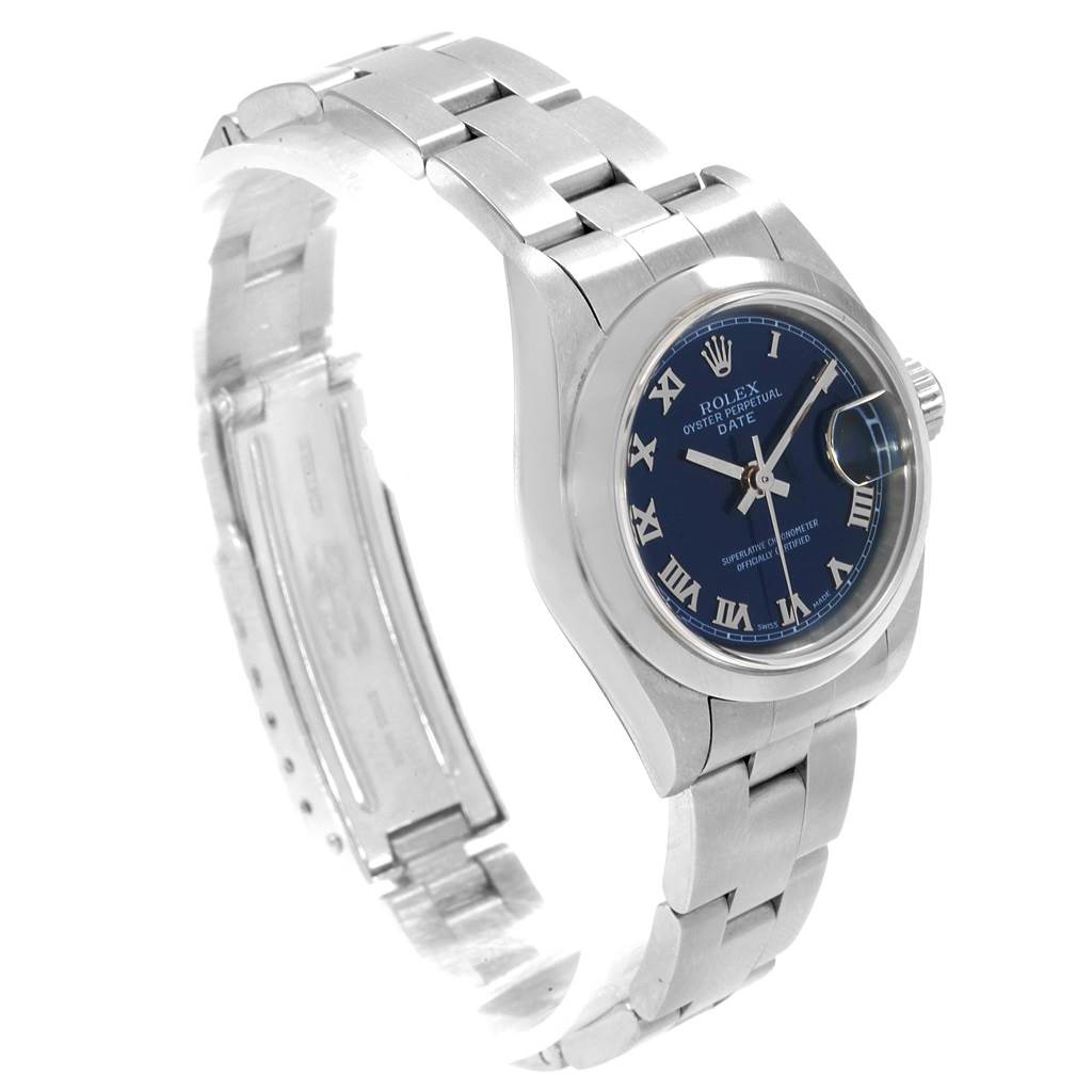 The image shows a Rolex Date 79160 Women's Stainless Steel Blue Dial 79160 Women's Stainless Steel Blue Dial watch with a blue dial, Roman numeral markers, and a stainless steel bracelet at an angled side view.