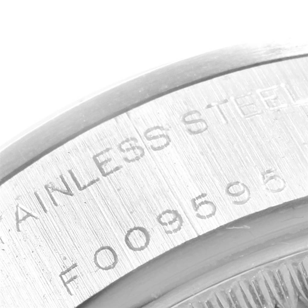 This image shows a close-up of the case back of a Rolex Date 79160 Women's Stainless Steel Blue Dial 79160 Women's Stainless Steel Blue Dial model, highlighting the stainless steel engraving and serial number.