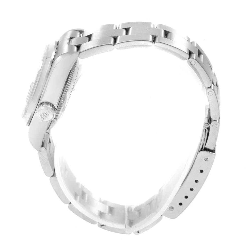 The Rolex Date 79160 Women's Stainless Steel Blue Dial 79160 Women's Stainless Steel Blue Dial model watch is shown from the side, highlighting the watch case, crown, and bracelet.