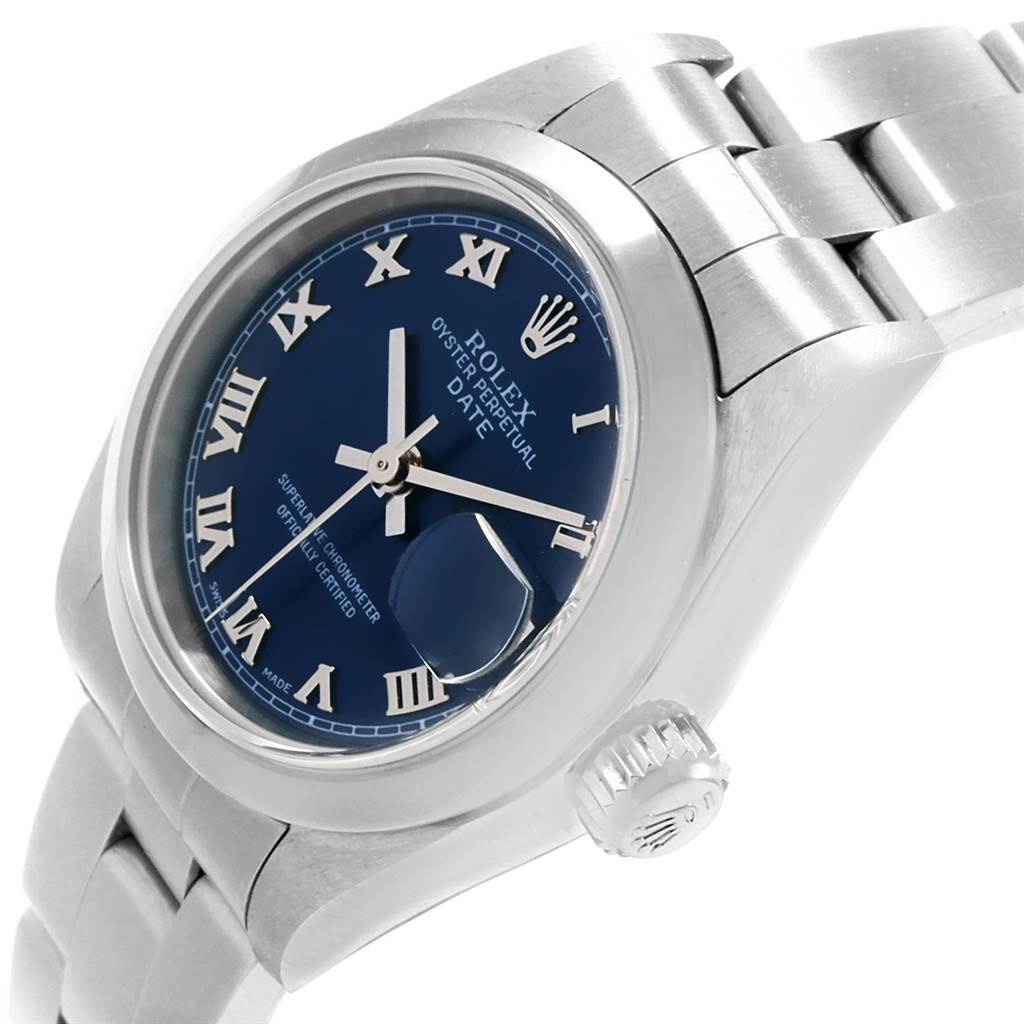 The image shows a close-up of the Rolex Date 79160 Women's Stainless Steel Blue Dial 79160 Women's Stainless Steel Blue Dial model watch face, crown, and part of the bracelet from a slight angle.